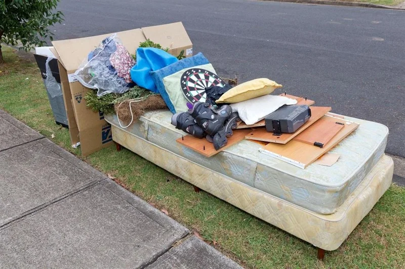 Mattress and household rubbish items left kerbside for pickup in Rivervale suburb